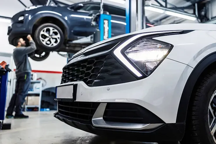 Fleet vehciles being worked on by a Dynamic Fleet Services mechanic